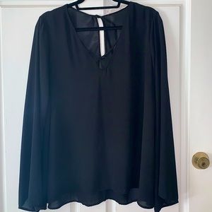 Flowy black blouse with criss cross top and bell sleeves